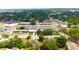 A wide aerial shot displaying a school complex situated in a residential area with ample parking at 3306 E Chelsea St, Tampa, FL 33610