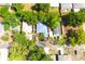 Aerial view of a home surrounded by mature trees and neighboring properties at 3306 E Chelsea St, Tampa, FL 33610