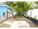 Backyard with sparse landscaping, and a concrete patio at 3306 E Chelsea St, Tampa, FL 33610