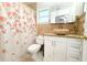 Stylish bathroom featuring a stone sink, decorative tile, and bathtub at 3306 E Chelsea St, Tampa, FL 33610