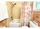 Clean bathroom featuring a shower, toilet, and shower curtain at 3306 E Chelsea St, Tampa, FL 33610