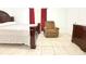 Cozy bedroom with a comfortable bed, recliner, and ample closet space at 3306 E Chelsea St, Tampa, FL 33610