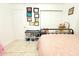 Well lit bedroom featuring a bed and a variety of wall decorations at 3306 E Chelsea St, Tampa, FL 33610