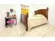 Cozy bedroom with neutral tile flooring and simple decor at 3306 E Chelsea St, Tampa, FL 33610