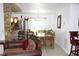 Cozy living and dining area with natural light, a dining table, and bar seating at 3306 E Chelsea St, Tampa, FL 33610