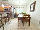 Bright dining room features a wooden table set, a mirror, and a view from a window at 3306 E Chelsea St, Tampa, FL 33610