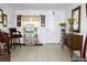 Bright entryway featuring tile flooring, neutral paint, and a view of the front door and hallway at 3306 E Chelsea St, Tampa, FL 33610