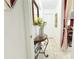Inviting hallway featuring neutral decor and tiled flooring, with a view of the living area at 3306 E Chelsea St, Tampa, FL 33610