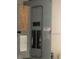 Electrical panel is visible on a wall with diagrams and switches for managing power distribution at 35209 Dolphin Lake Dr, Zephyrhills, FL 33541