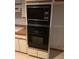 A classic kitchen features black appliances and ample cabinet space at 35209 Dolphin Lake Dr, Zephyrhills, FL 33541
