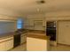 A functional kitchen offers plentiful cabinets and modern appliances at 35209 Dolphin Lake Dr, Zephyrhills, FL 33541