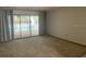 Living room with view of pool and backyard at 35209 Dolphin Lake Dr, Zephyrhills, FL 33541