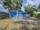 Backyard view of a blue house with a small deck and outdoor space at 3706 N Ola Ave, Tampa, FL 33603