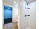 Bathroom featuring a tile shower with modern fixtures and wood look tile flooring at 3706 N Ola Ave, Tampa, FL 33603