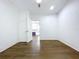 Bedroom with hard wood floors, a ceiling fan, and an attached closet at 3706 N Ola Ave, Tampa, FL 33603