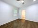 Bedroom featuring hardwood floors, white trim, and a window for natural light at 3706 N Ola Ave, Tampa, FL 33603