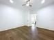 Bedroom featuring hardwood flooring, white trim, ceiling fan, and natural light at 3706 N Ola Ave, Tampa, FL 33603