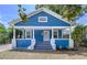 Charming blue home with a cozy front porch and white trim at 3706 N Ola Ave, Tampa, FL 33603