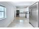 View of the kitchen with tile floors, stainless appliances, and neutral color palette at 3706 N Ola Ave, Tampa, FL 33603