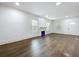 Bright living room with dark hardwood floors and a modern electric fireplace at 3706 N Ola Ave, Tampa, FL 33603