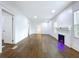 Bright and spacious living room with new wood floors and electric fireplace at 3706 N Ola Ave, Tampa, FL 33603