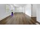 Spacious living room featuring hardwood floors and a modern electric fireplace at 3706 N Ola Ave, Tampa, FL 33603