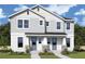 Charming two-story home featuring a welcoming entrance and beautifully landscaped front yard, perfect for suburban living at 404 N Westland St # 1, Tampa, FL 33609