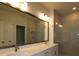 Bathroom with dual vanity, large mirrors and a glass enclosed shower at 404 N Westland St # 1, Tampa, FL 33609