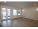 Bright living room with multiple windows and access to outdoor patio space at 404 N Westland St # 1, Tampa, FL 33609