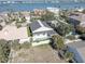 Beautiful aerial view showcasing the home's pool and location near the water at 413 8Th N Ave, Tierra Verde, FL 33715