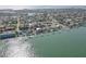 Magnificent aerial view of waterfront homes, docks, boat lifts, and the ocean coastline at 413 8Th N Ave, Tierra Verde, FL 33715