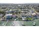 Stunning aerial view of a waterfront neighborhood with homes, docks, and boat lifts at 413 8Th N Ave, Tierra Verde, FL 33715