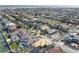 Expansive aerial view of the neighborhood with pools and construction near the water at 413 8Th N Ave, Tierra Verde, FL 33715