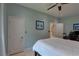 Bedroom featuring light blue walls, white doors, neutral flooring, and simple, comfortable furnishings at 413 8Th N Ave, Tierra Verde, FL 33715