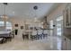 Spacious kitchen has an island with seating and stainless steel appliances at 413 8Th N Ave, Tierra Verde, FL 33715