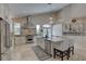 Gourmet kitchen featuring stainless steel appliances, granite countertops, and a kitchen island at 413 8Th N Ave, Tierra Verde, FL 33715