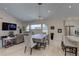 Open concept living and dining area next to the kitchen at 413 8Th N Ave, Tierra Verde, FL 33715