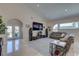 Spacious living room with high ceilings, tile floors, and plenty of natural light at 413 8Th N Ave, Tierra Verde, FL 33715