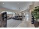 Spacious living room and kitchen with open concept and spiral staircase at 413 8Th N Ave, Tierra Verde, FL 33715