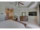 Main bedroom with en suite bathroom, neutral walls, ceiling fan, and tiled floors at 413 8Th N Ave, Tierra Verde, FL 33715