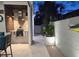 Outdoor kitchen featuring a grill, modern lighting, and manicured plants at 413 8Th N Ave, Tierra Verde, FL 33715