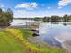 Scenic aerial view of a gazebo on a lake, connected by a wooden dock at 4141 Dolphin Dr # 4141, Tampa, FL 33617
