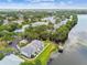 Aerial view showcasing condo buildings, a pool, lakeside boardwalk and gazebo at 4141 Dolphin Dr # 4141, Tampa, FL 33617