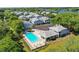 Aerial view of Waterside community with pool and lush landscaping at 4141 Dolphin Dr # 4141, Tampa, FL 33617