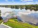 Breathtaking aerial view of a lake with a wooden gazebo and lush greenery, highlighting the natural beauty at 4141 Dolphin Dr # 4141, Tampa, FL 33617