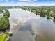 Scenic aerial view of a lake with a boardwalk and gazebo at 4141 Dolphin Dr # 4141, Tampa, FL 33617