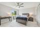 Bright bedroom with a lake view, sleek tiled floors, and stylish furniture at 4141 Dolphin Dr # 4141, Tampa, FL 33617