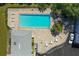 Aerial shot of community pool area with lounge chairs and tables at 4141 Dolphin Dr # 4141, Tampa, FL 33617