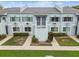 Apartment building featuring neutral paint, well-maintained landscaping, and walkways at 4141 Dolphin Dr # 4141, Tampa, FL 33617