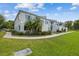 Corner view of a two-story condominium complex surrounded by well-kept lawns and verdant landscaping at 4141 Dolphin Dr # 4141, Tampa, FL 33617